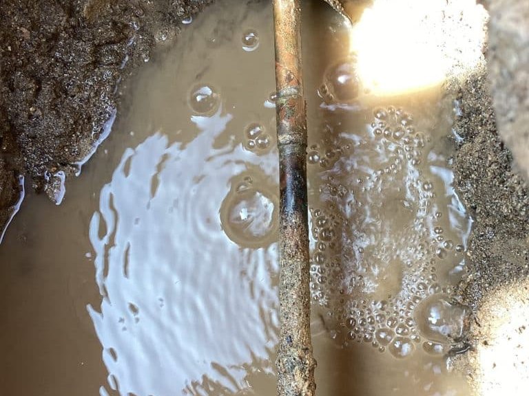 Underground line exposed for repair