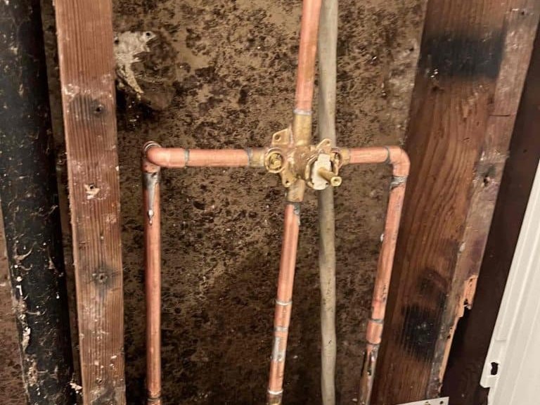 New copper repipe run through an open wall cavity