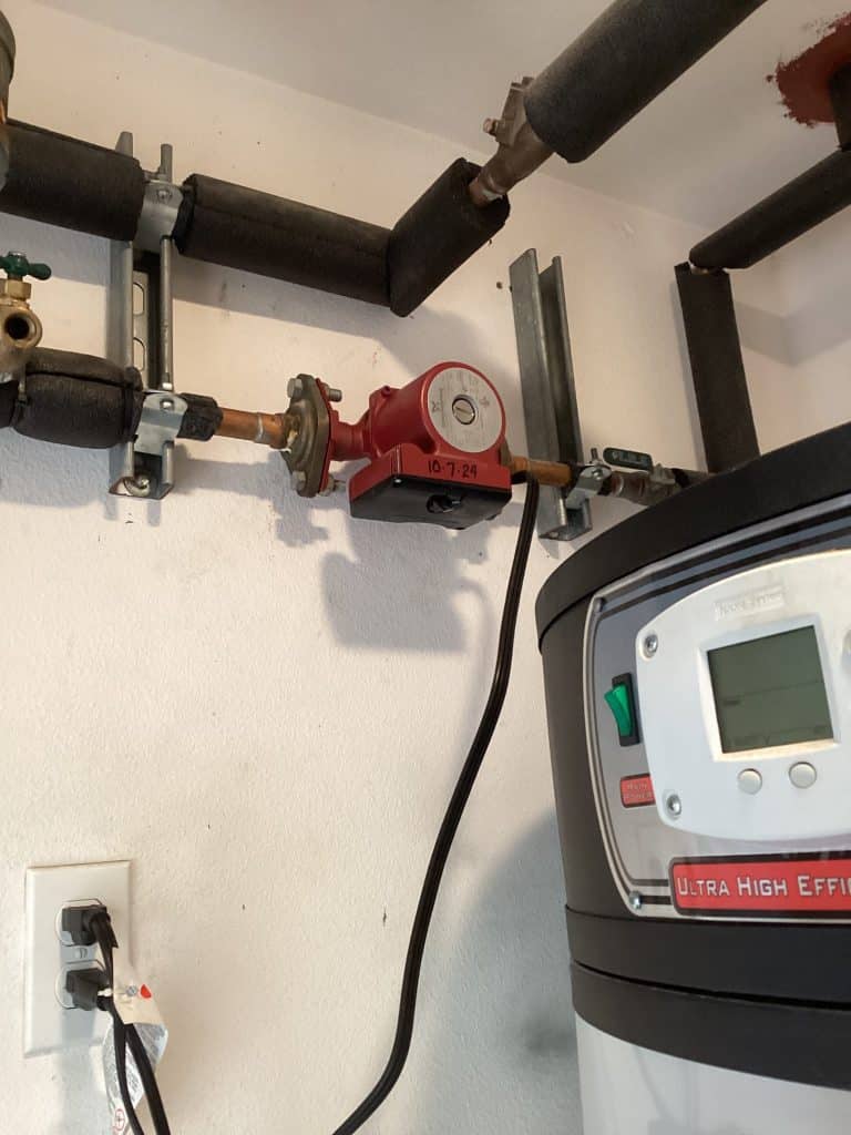Recirculating pump on the hot-water line beside the heater