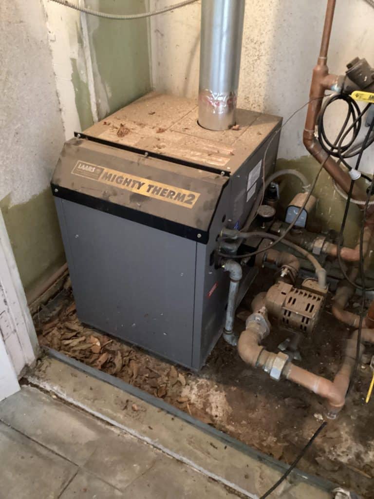 Gas boiler in a utility closet, serviced on a same-day call