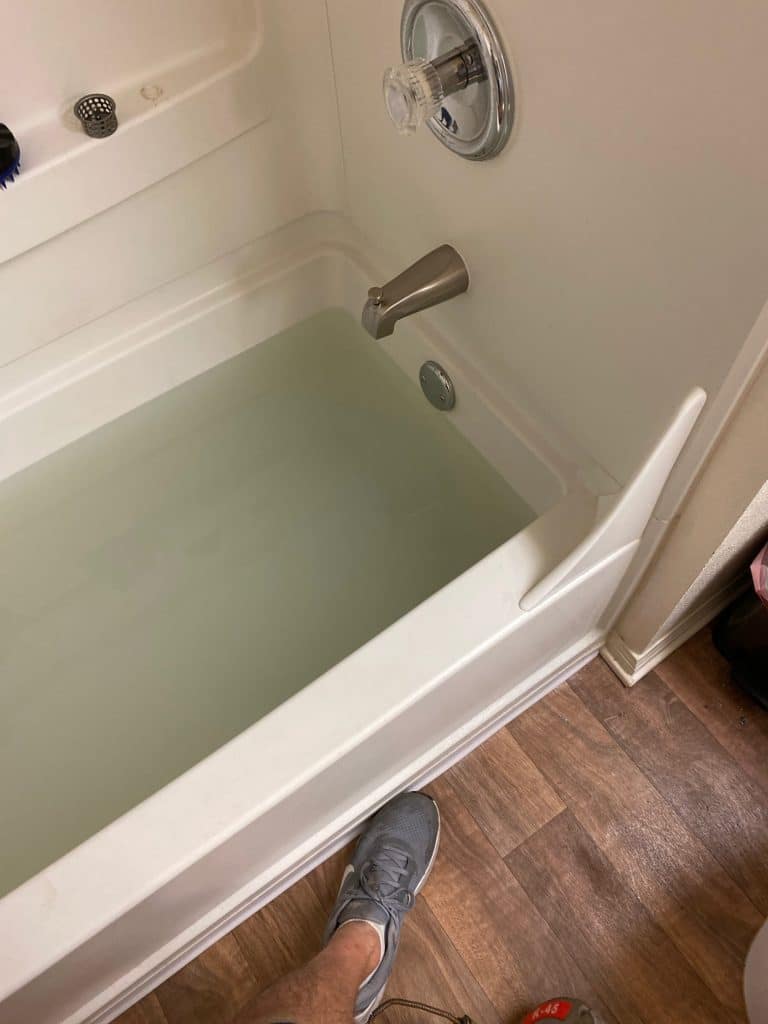 Standing water in a tub before the drain line was cleared
