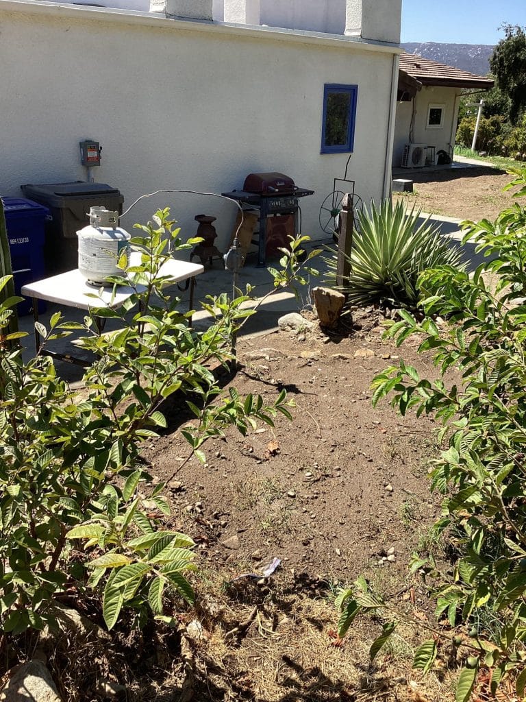 Trench backfilled along the house