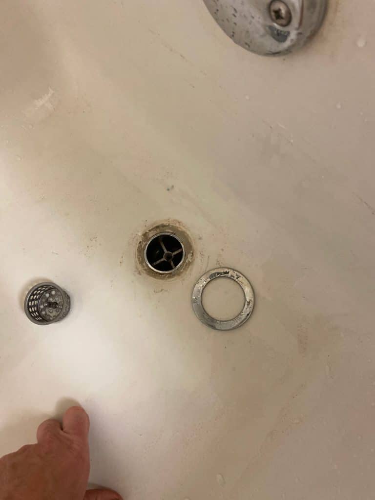 Tub drain with the strainer and overflow trim removed